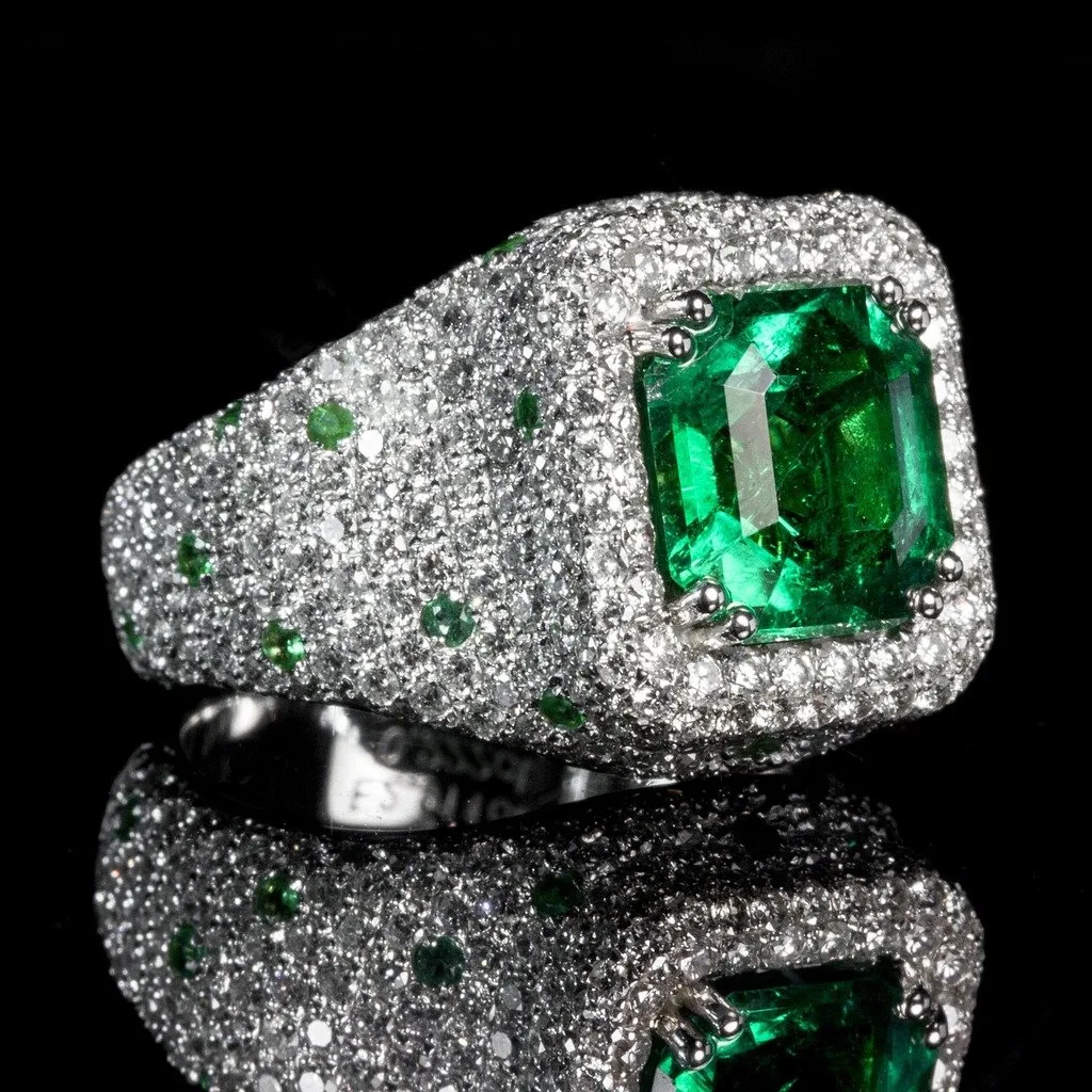 Emerald ring image showing green emerald color in a finished jewelry setting