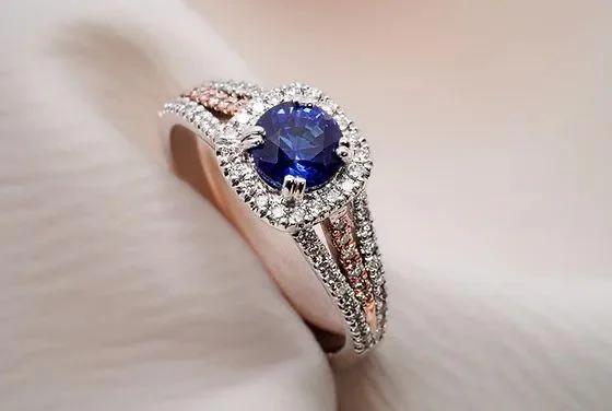 Sapphire and diamond ring showing a blue sapphire center stone in a finished jewelry setting